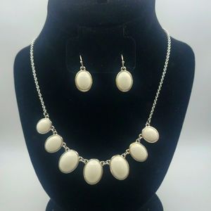 White oval necklace and matching earrings